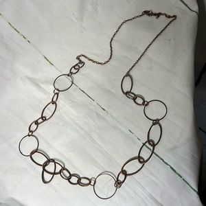 Long brass color necklace